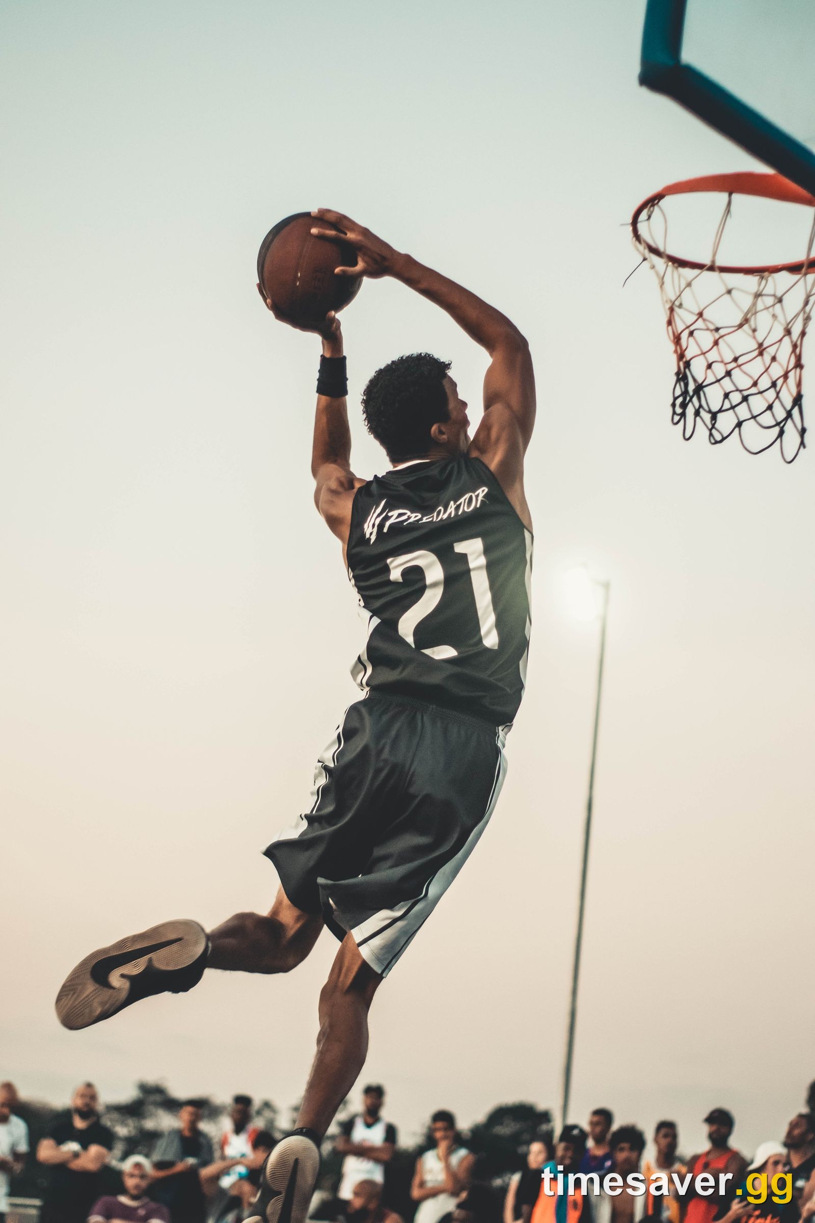 Dramatic outdoor basketball action shot, mood hero for an NBA 2K27 small forward build guide